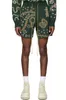 Rhude mäns shorts American High Street Sticked Hawaiian Flower Loose Cashew Flower Drawstring Woolen Green Mens and Women's Short