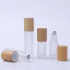 Wholesale 5ml 10ml New Frosted Glass Roll On Bottles with Metal Roller Ball And Bamboo Lids