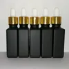 Frasco conta-gotas de reagente de vidro fosco preto 30ml Frasco quadrado de óleo essencial para perfume Óleos de fumaça e frasco líquido com tampa dourada Gfbkv