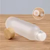 Frosted Glass Jar Cream Flaskor Runt kosmetiska burkar Hand Face Lotion Pump Bottle With Wood Cap VBQDX