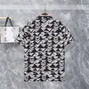 Mężczyźni designerskie koszule Summer Shoort Sleeve swobodne koszule moda luźna polo w stylu plażowym oddychając Tshirts Tees odzież M-3xl UG1