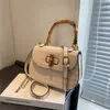 Yeni kadın çantası yüksek timsah desen bambu düğüm çanta tatlı katı eyer moda crossbody fabrikası online% 70 satış