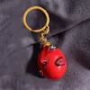 Nyckelringar 1997 Berserk Behelit Griffith Egg of King Cosplay Keychain Unisex Harts Pendant Keyring smycken Tillbehör Props 230614