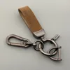 Porte-clés voiture porte-clés astronaute pendentif en cuir porte-clés anneau ornements cadeaux créatifs pour hommes et femmes porte-clés accessoires 230614