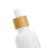 Bottiglie di olio essenziale di vetro in porcellana bianca Flacone contagocce per siero per la cura della pelle con pipetta di bambù 10ml 15ml 20ml 30ml 50ml 100ml Anqii