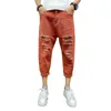 Jeans masculino Cool Men Nona calça com botão rasgado e zíper coreano Calças de cor sólida Roupas masculinas