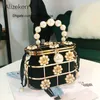 Totes Pearl Basket Pochette da sera Donna Famoso marchio Scava fuori fiori Borsa con pochette metallizzata con perline Borsa a secchiello coreana