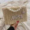 Small and Fashionable Handheld Pearl Women's Bag 2023 New Fashion One Shoulder Grass Woven Fairy Women's Bag Versatile Weaving Crossbody Bag 230614