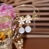 Diseño de pendientes colgantes de 14 km bola de agua de flores chapadas en oro para mujeres joyas de niña S925 Silver Needle Zirconia