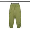 23SS Spring Men Cotton Pants Basic Compass Badge broderad högkvalitativ verktygsfickfickbyxor Sport bär avslappnad 2705234b