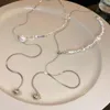 Tour de cou léger luxe perle Triangle tirant gland collier pour femmes Simple à la mode collier chaîne personnalisé exquis