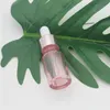 Kersenroze Glas Essentiële Olie Parfumflesje Vloeibaar Reagens Pipet Druppelflesjes met Rose Gouden Dop 10-50 ml Hjtlj