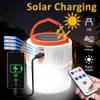 Solar LED -gloeilamp met zijkobse spotlight en telefoonlaad, 5 -modus, hoge heldere zonne -led -lamp voor kamperen wandelvissen noodsituatie