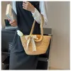 Bolsos de playa 23 New Vine Knitted Pearl Tote Bag Bolso tejido a mano para mujer Estilo de vacaciones Hombro de gran capacidad
