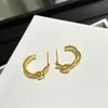 Nieuw ontworpen TRIOMPHE Knot Hoops OORBELLEN IN MESSING MET GOUD GLANZENDE VROUWEN OOR HOOPS Designer Sieraden ER891