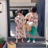 家族をマッチする服装子供の兄弟姉妹の服セット夏の男の子と女の子ゆるい牡丹プリント半袖ショーツセットバブルスリーブスカート230614