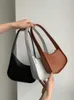 Raden Half Moon Bag Women's Spring and Summer Popular Design High Quality Kendou äkta läder Enkel axel underarm Bag