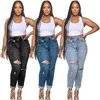 Kvinnor plus storlek jeans modekläder personliga trasiga hål diagonala spänne elastiska denim leggings långa byxor