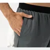 LL Pantalones cortos para hombre Traje de yoga Pantalones cortos para hombre Correr Deporte Baloncesto Transpirable Entrenador Pantalones Ropa deportiva para adultos Gimnasio Ejercicio Ropa deportiva Elástico de secado rápido