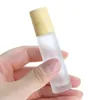 10ml Amber Blue Clear Frosted Glass Roll On Bottle Óleo essencial Frasco de perfume Dispensador de viagem Garrafa de aço Roller Ball Grão de madeira Ca Mukn