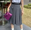 المصمم MIUI للسيدات القصيرة الطويلة التنانير الصيفية Girls Classic Tirt Tirp Top Mini Maxi Jaxi Trild Black A-Line Skirt Small Leather Dress