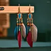 Orecchini pendenti con piume etniche con nappe bohemien per gioielli con perline di semi a goccia lunga da donna