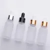 wholesale Flacone contagocce in vetro smerigliato da 30 ml bottiglie di olio essenziale vuote siero con tappo nero in nastro d'oro Nulvl