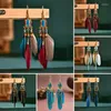 Orecchini pendenti con piume etniche con nappe bohemien per gioielli con perline di semi a goccia lunga da donna