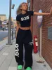 Spodnie damskie capris qweek koreański list modny druk joggery dresowe kobiety Kpop Streetwear Black Oversizes szerokie nogi sportowe spodnie Hip Hop Punk 230615