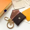 Tasarımcı Mektup Cüzdan Keychain Keyasyon Moda Çantası Kolye Araba Zinciri Cazibesi Kahverengi Çiçek Mini Çanta Biblo Hediyeleri Aksesuarlar Hayır B275D