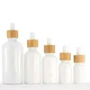 Bottiglie di olio essenziale di vetro di porcellana bianca Flacone contagocce per siero per la cura della pelle con pipetta di bambù 10ml 15ml 20ml 30ml 50ml 100ml Sirnd