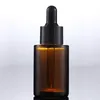 Botellas de perfume de aceite esencial de vidrio de 30 ml Botella de cuentagotas de pipeta de reactivo líquido Botella cilíndrica de hombro plano Axbok transparente / esmerilado / ámbar