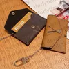 Designer Keychain Wallet Key Ring Keychain Pouch Luxury Key Chains Credit Card Holder Headset Lipstick Bag Coin Bag Pendant Fashion Envelope Charm Accessories