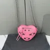 Luxury designer mini Heart Bags Fashion Solid color leather Shoulders bag handbags Chain shoulder Cross body bags Locomotive rivet Evening Bags Cosmetic Bags totes