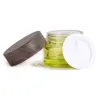 Olivgrön glas kosmetiska burkar tomma makeup provbehållare flaska med träkorn läcktät plastlock bpa gratis för lotion, grädde loit