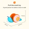 Novelty Games ZK30 Pull String Cartoon Snail Car Toy Baby Lär dig att krypa och leksak med lätt musik Tidig utbildningsleksaker för barn 230617