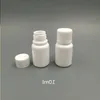 100pcs 10ml 10cc 10g小さなプラスチック容器シールキャップのふたが付いたピルボトル、空の白い丸いプラスチックピル薬ボトルjosoj