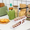 Bottiglie di stoccaggio Portauovo rotante Contenitore dispenser automatico a scorrimento 12-14 uova Organizzatore da cucina per dispensa Frigorifero da appoggio