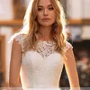 Romantic O-Neck Button Back Wedding Bridal Dresses Cap Sleeve Appliques Satin Castle Bride Gowns Court Train