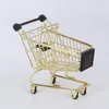 Lagringsflaskor vagn Basket Ornament Golden Mini Shopping Basket. Vagn liten mellanmål containrar hem dekor leksak skrivbord po props