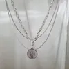 Colliers à pendentif Style euro-américain Collier en acier au titane multicouche Texture Premium Unfading Tête humaine Coin Hip Hop