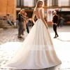 Romantic O-Neck Button Back Wedding Bridal Dresses Cap Sleeve Appliques Satin Castle Bride Gowns Court Train