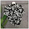 Mężczyźni designerskie koszule Summer Shoort Sleeve Casualne koszule moda luźna polo w stylu plażowym oddychając Tshirts Tees odzież M-3xl Q10