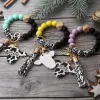 New Party Silicone Cursive Cow Bead Bracelet Wood Disk Bracelet Keychain Cow Tassel Ox Head Wrist Key Ring Charm Pendant Accessory