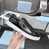Designer pradxx sneaker top layer cowhide men's shoes slide shoes patent leather soft rubber fabric casual shoes black and white outdoor shoes running shoes.