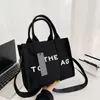 Designer-Designer-Tasche, modisch, Reißverschluss, Gürteltasche, Mini-Handtasche, Umhängetasche, Luxus-Geldbörse, ovales Leder, Liebesmuster