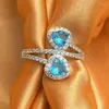 Anneaux de mariage Huitan voir coeur bleu CZ femmes pour fiançailles accessoires anniversaire amour cadeau à la mode luxe bijoux en vrac