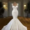 2023 Sexiga sjöjungfru bröllopsklänningar underbara ärmlösa spetsar applikationer illusion kristallpärlor juvel hals spaghettirem brudklänningar kyrka brud bröllopsklänning