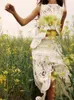 2ピースドレスかぎ針編みの非対称の女性用ドレスセットシックなOネックノースリーブトップショートスカートスーツファッションフェアリースウィート衣装230620