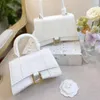 2023 New Plain Metallic Women's Summer Hot Hand-held One-shoulder Hourglass Cute Small High-end Bag Style Factory Online 70% sale